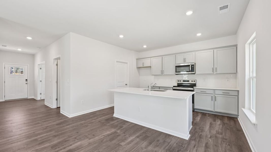 Furnished interior view inside a new home in Gretchen Pines, West End (Image 5).