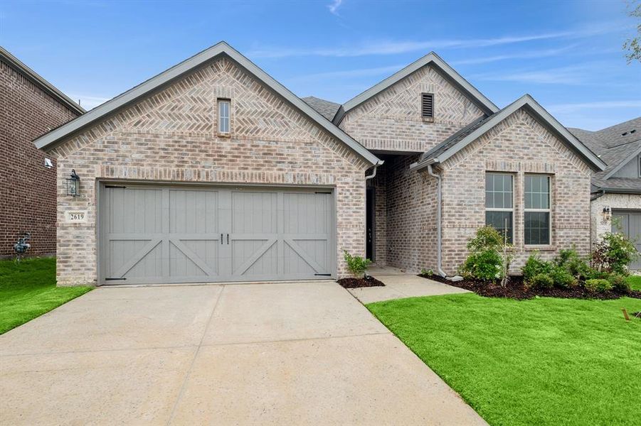 Front exterior of a new home in Lilybrooke at Legacy Hills, Celina, TX, highlighting curb appeal (Image 2). Front exterior of a new home in Lilybrooke at Legacy Hills, Celina, TX, highlighting curb appeal (Image 2).
