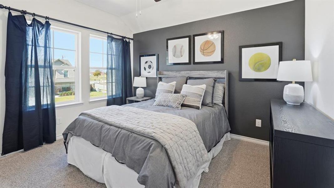 Bedroom featuring light carpet, a ceiling fan, and lofted ceiling