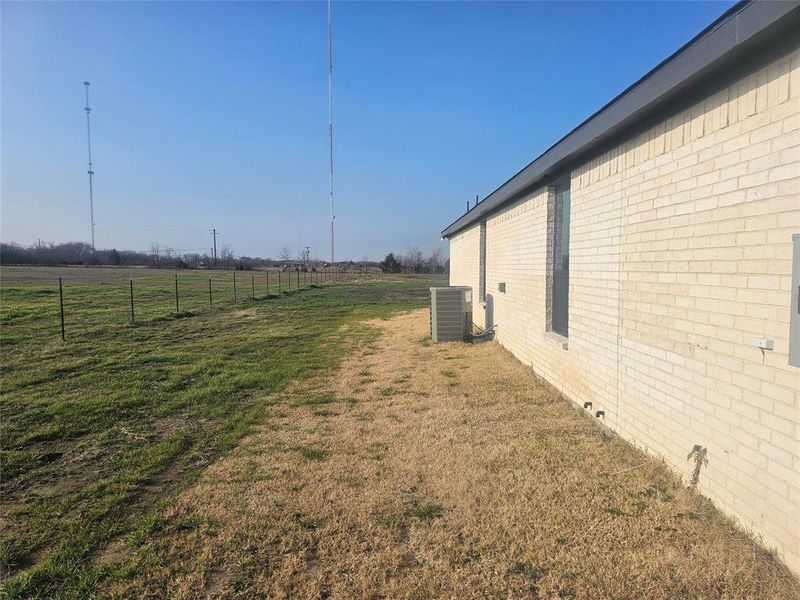 Exterior details and patio area of a home in Corsicana Commons, Corsicana (Image 3).