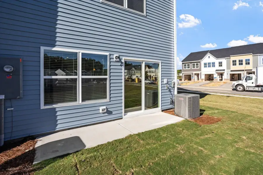 Exterior details and patio area of a home in West Main Townhomes, Sanford (Image 2). Exterior details and patio area of a home in West Main Townhomes, Sanford (Image 2).