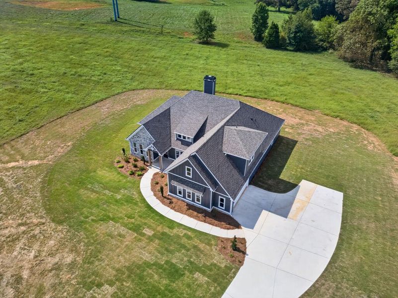 Front exterior of a new home in Veal Meadows, Roopville, GA, highlighting curb appeal (Image 27). Front exterior of a new home in Veal Meadows, Roopville, GA, highlighting curb appeal (Image 27).