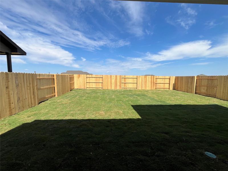 Front exterior of a new home in The Homestead at Lariat, Liberty Hill, TX, highlighting curb appeal (Image 15). Front exterior of a new home in The Homestead at Lariat, Liberty Hill, TX, highlighting curb appeal (Image 15).