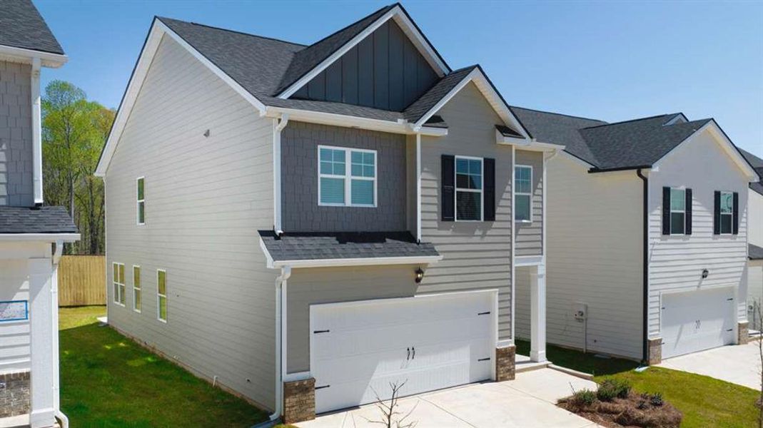 Front exterior of a new home in Shoal Creek, Hampton, GA, highlighting curb appeal (Image 20).
