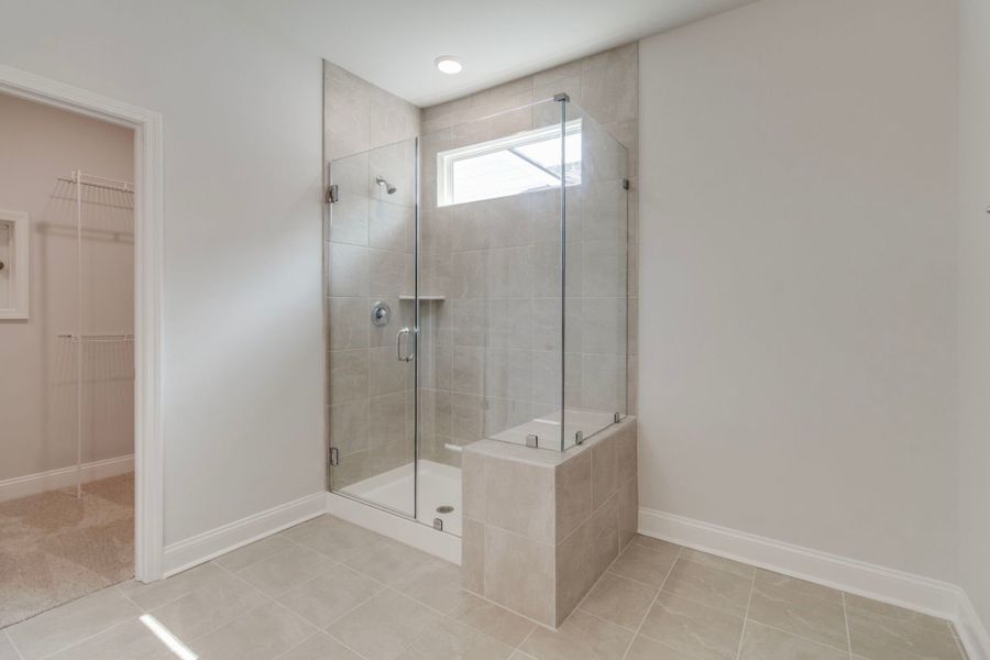 Ample room for movement and a built-in shower bench for added comfort and functionality.