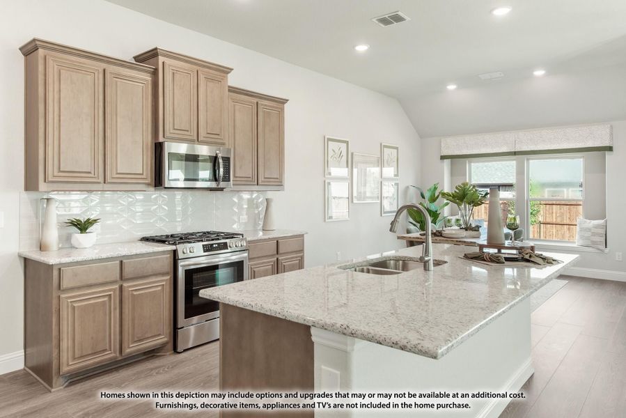 Kitchen with tan wood cabinets, granite island, stainless steel appliances, and white tile backsplash Kitchen with tan wood cabinets, granite island, stainless steel appliances, and white tile backsplash