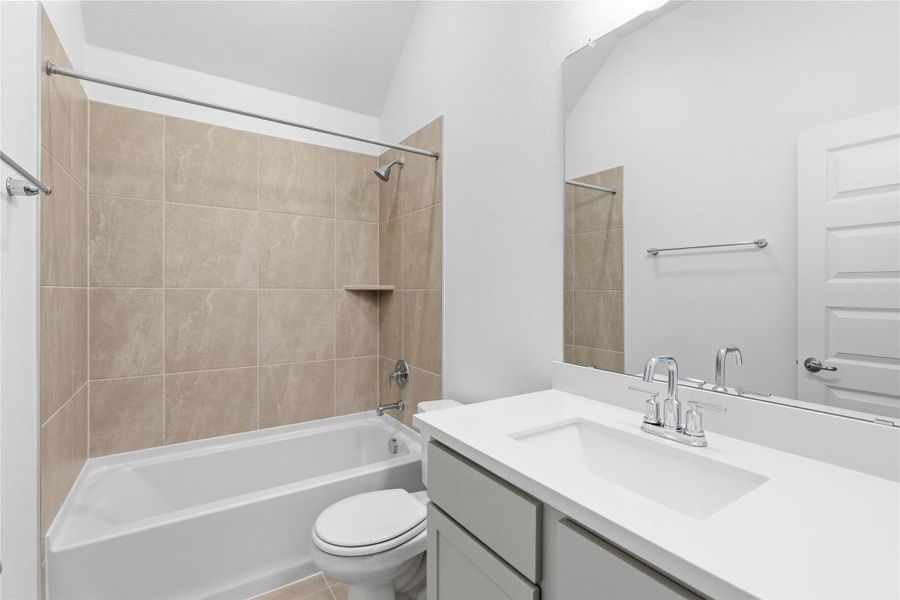 Full bath featuring shower / bath combination and vanity