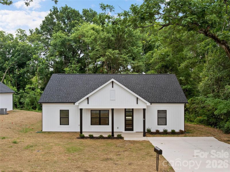 Front exterior of a new home in , Stanley, NC, highlighting curb appeal (Image 21).