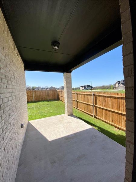 Nice covered back patio for grilling