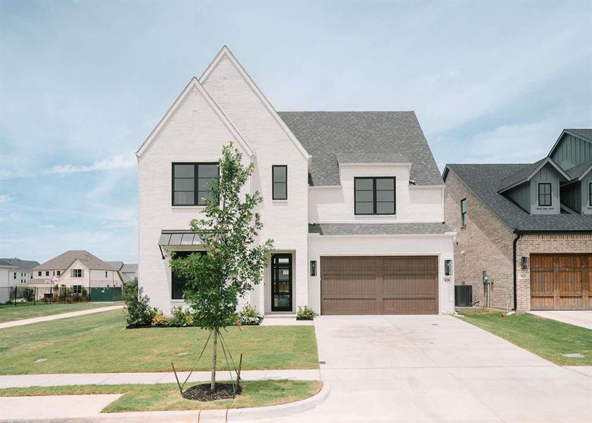 Front exterior of a new home in , Aledo, TX, highlighting curb appeal (Image 2). Front exterior of a new home in , Aledo, TX, highlighting curb appeal (Image 2).