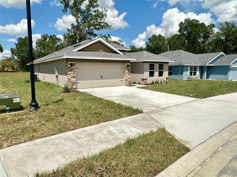 Front exterior of a new home in Oak Hill Plantation, Ocala, FL, highlighting curb appeal (Image 1). Front exterior of a new home in Oak Hill Plantation, Ocala, FL, highlighting curb appeal (Image 1).