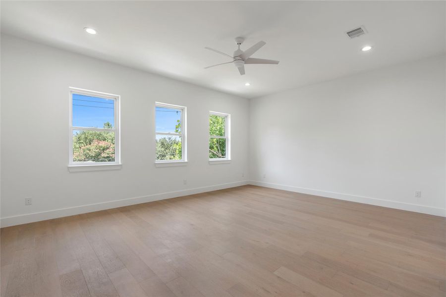 Spacious primary suite with abundant natural light.