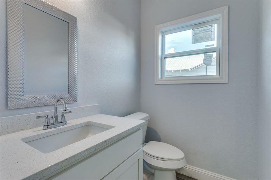 Bathroom with vanity and toilet