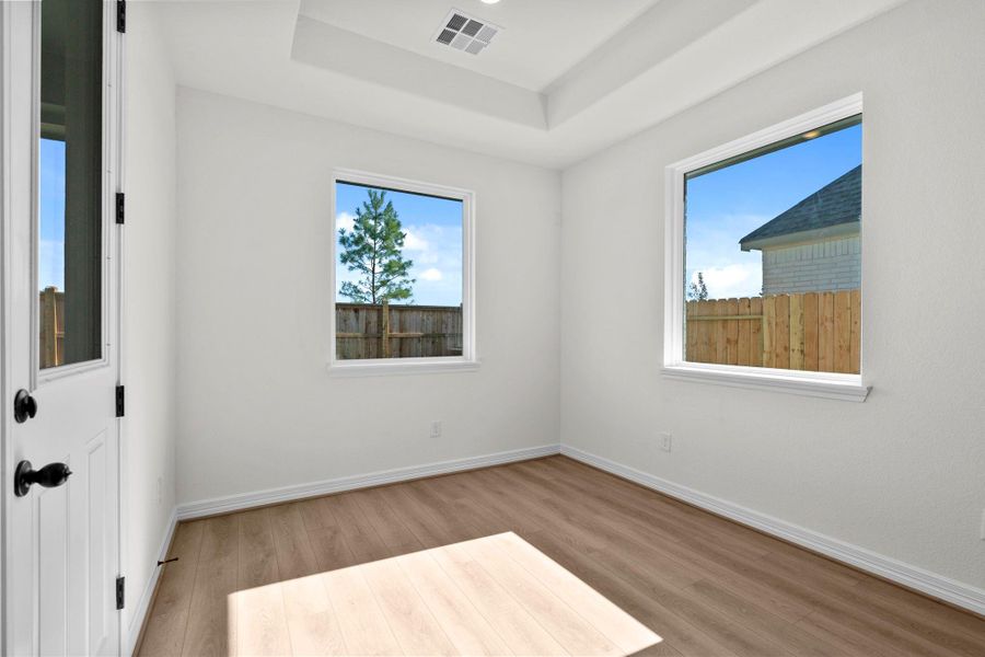 With an abundance of natural light streaming through the windows, the breakfast nook is bathed in a sunny glow, creating the perfect atmosphere to enjoy your morning coffee or a family breakfast.