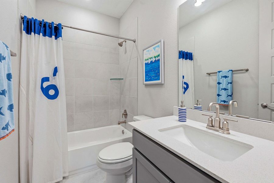 Full bath with vanity and shower / bathtub combination with curtain Full bath with vanity and shower / bathtub combination with curtain