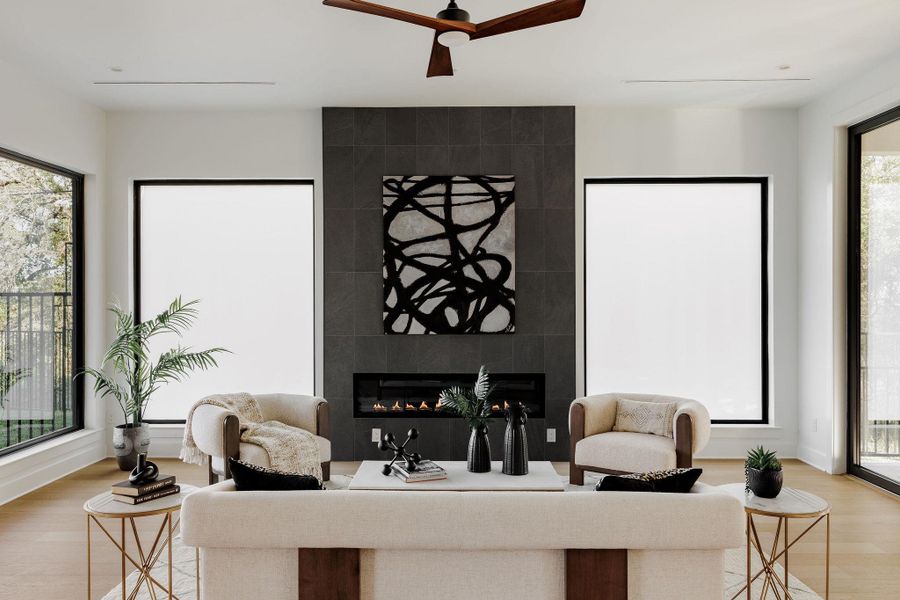 A striking sculptural fireplace with clean lines and warm materiality anchors the living space. A striking sculptural fireplace with clean lines and warm materiality anchors the living space.