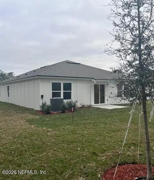 Exterior details and patio area of a home in Palm Coast Homesites, Palm Coast (Image 2).