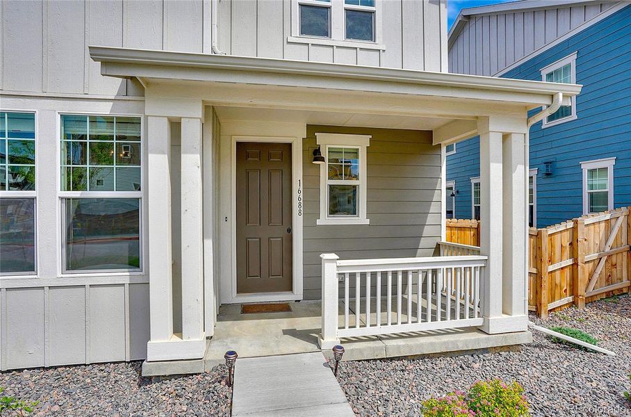 Front exterior of a new home in , Broomfield, CO, highlighting curb appeal (Image 24).