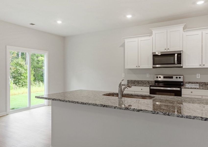 The kitchen comes with granite countertops.