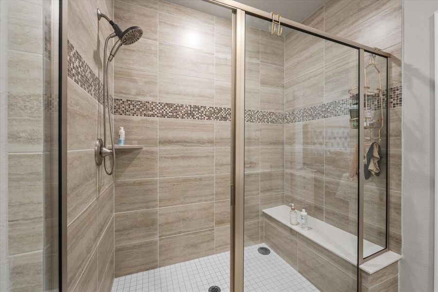 Bathroom with a shower with shower door