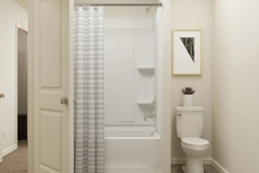 A bathroom with a shower curtain. A bathroom with a shower curtain.