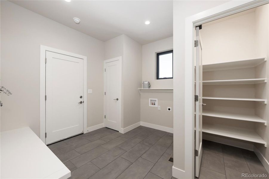 Pantry and laundry area near garage