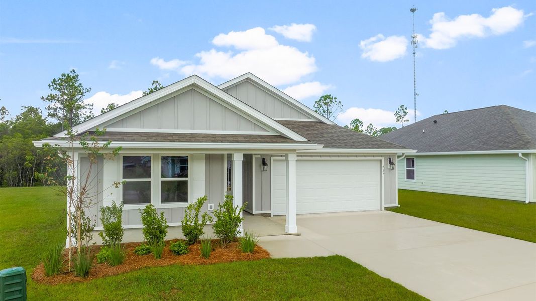 Front exterior of a new home in Palmetto Bluff, Port Saint Joe, FL, highlighting curb appeal (Image 2).