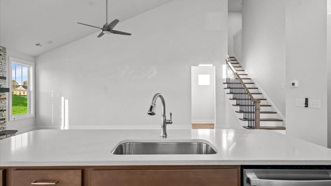 Accomplished design in a kitchen that blends function and form with a right-sized island