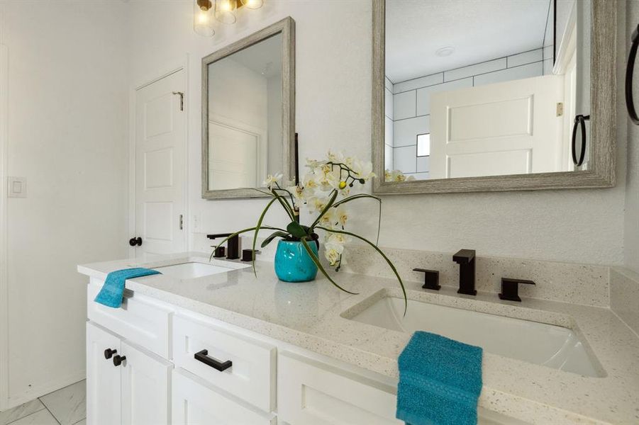 Bathroom with vanity and tile patterned flooring