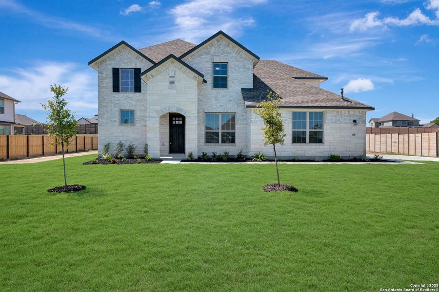 Front exterior of a new home in Everly Estates, San Antonio, TX, highlighting curb appeal (Image 2). Front exterior of a new home in Everly Estates, San Antonio, TX, highlighting curb appeal (Image 2).