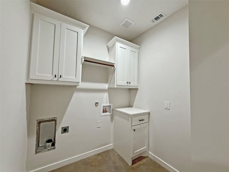 Laundry room featuring cabinet space, hookup for a washer/dryer.