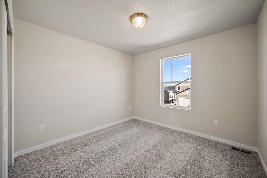 Spacious, unfurnished interior of a new home in Ridge at Lorson Ranch, Colorado Springs (Image 12).