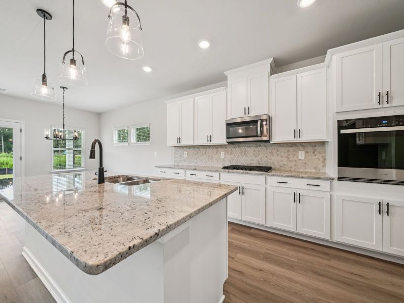 Furnished interior view inside a new home in Vines at Mill Creek - Estate Series, Braselton (Image 6).