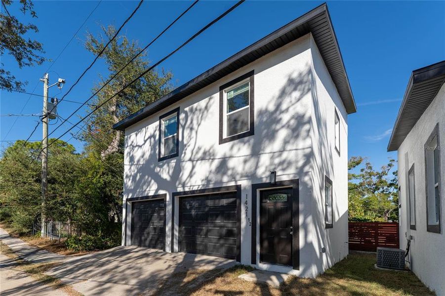 Front exterior of a new home in , St. Petersburg, FL, highlighting curb appeal (Image 2). Front exterior of a new home in , St. Petersburg, FL, highlighting curb appeal (Image 2).
