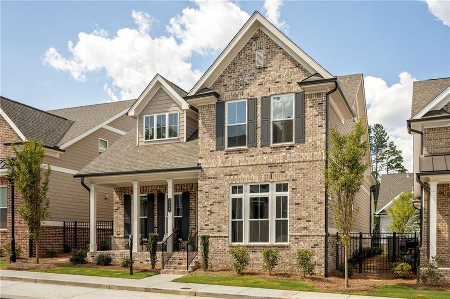 Front exterior of a new home in Evanshire Single Family, Duluth, GA, highlighting curb appeal (Image 26). Front exterior of a new home in Evanshire Single Family, Duluth, GA, highlighting curb appeal (Image 26).