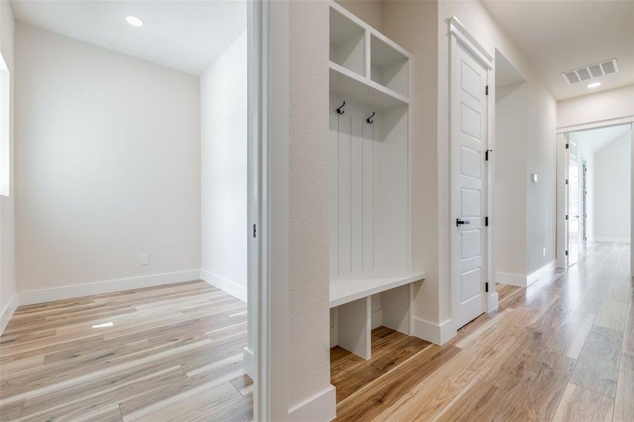 Mudroom featuring extra office/craft room