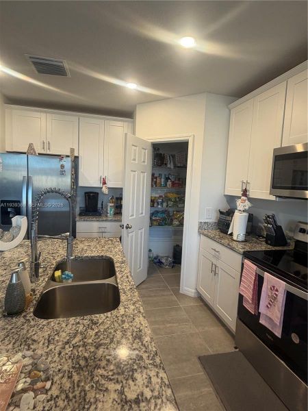 Furnished interior view inside a new home in , Haines City (Image 11).
