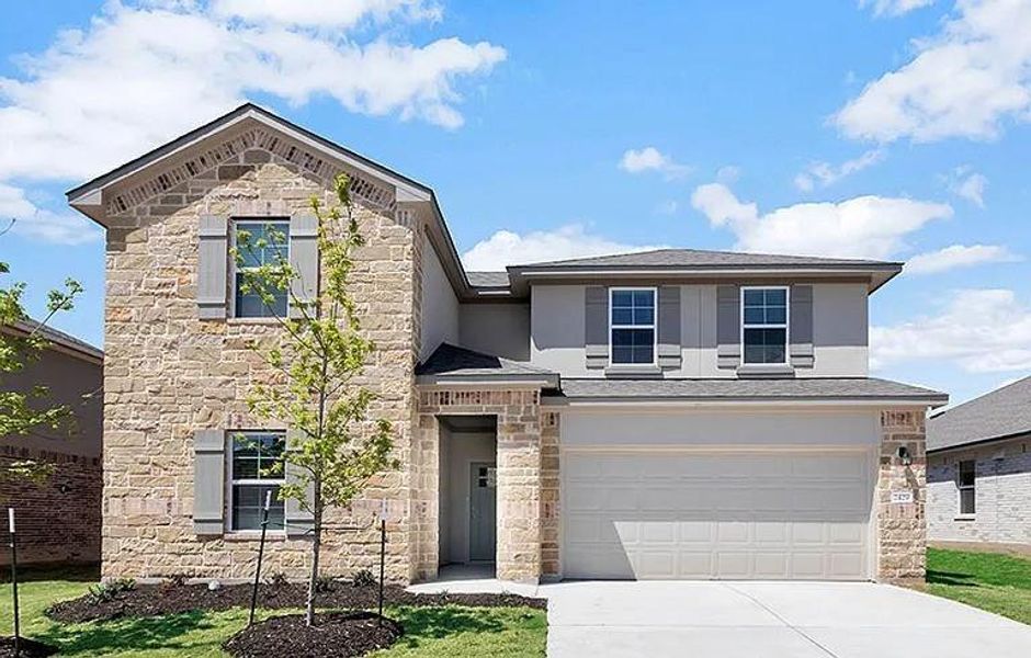 Front exterior of a new home in Bar W Ranch, Leander, TX, highlighting curb appeal (Image 1). Front exterior of a new home in Bar W Ranch, Leander, TX, highlighting curb appeal (Image 1).