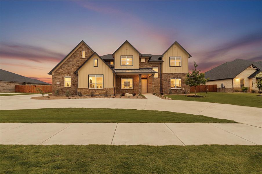 Expansive two-story residence featuring a stone and board-and-batten facade with multiple gables