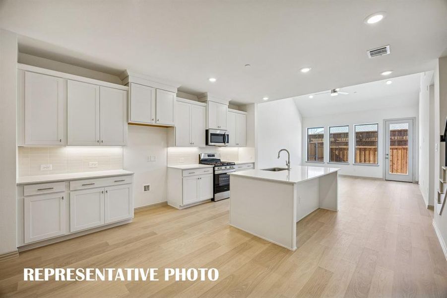 You'll enjoy outstanding storage and prep space in this dream kitchen!  REPRESENTATIVE PHOTO