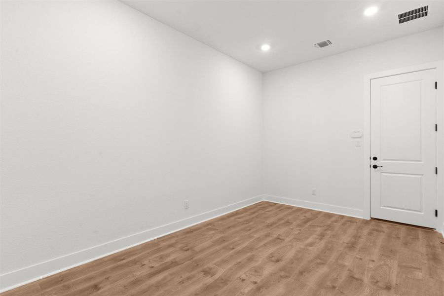 Unfurnished room featuring light wood-type flooring and recessed lighting