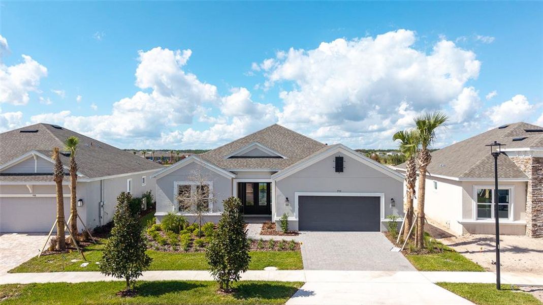 Front exterior of a new home in , St. Cloud, FL, highlighting curb appeal (Image 20).