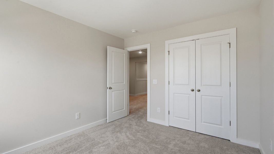 Secondary bedroom with convenient double closet doors