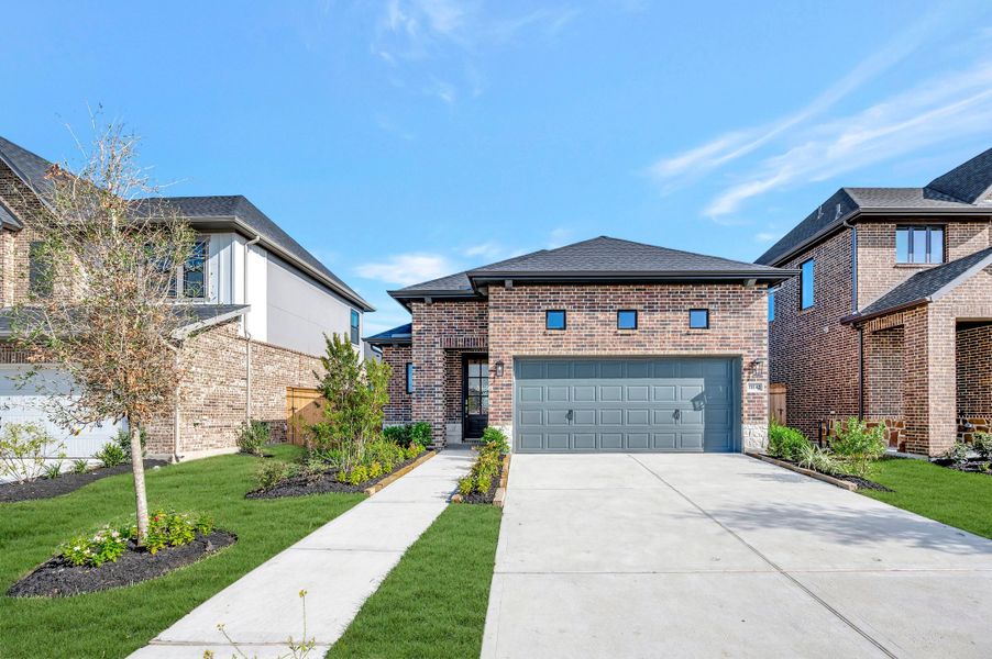 Front exterior of a new home in Sienna - Grove Collection, Missouri City, TX, highlighting curb appeal (Image 26).