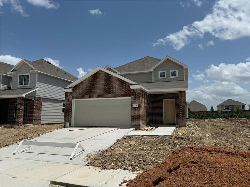Front exterior of a new home in Retreat at Fossil Creek, Fort Worth, TX, highlighting curb appeal (Image 1).