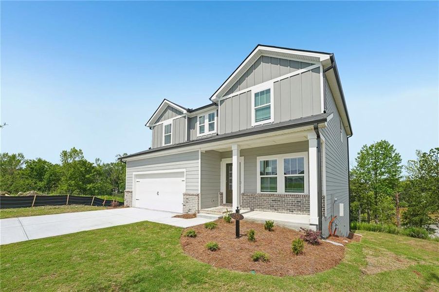 Front exterior of a new home in Ivey Township, Dallas, GA, highlighting curb appeal (Image 26).
