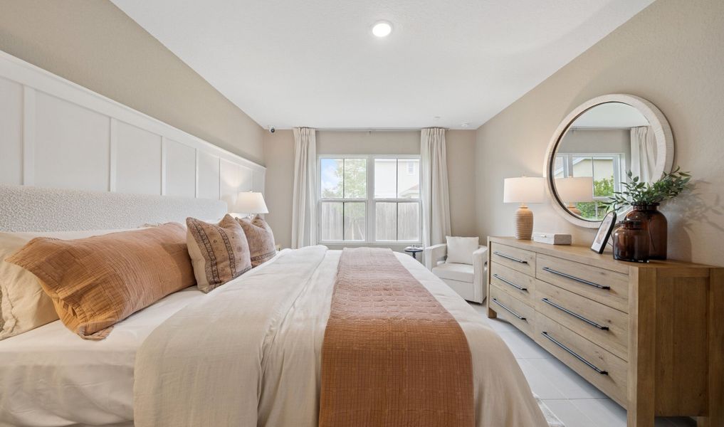 Primary suite with decorative feature wall