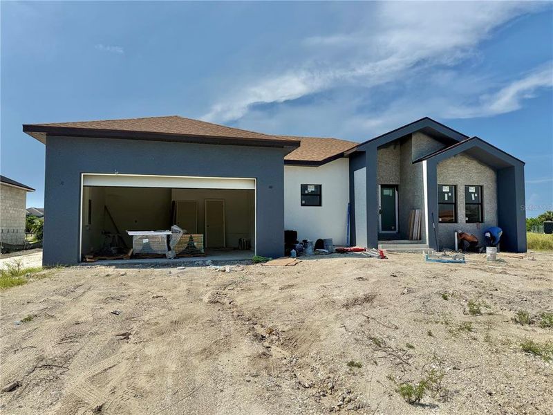 Front exterior of a new home in , Port Charlotte, FL, highlighting curb appeal (Image 2).