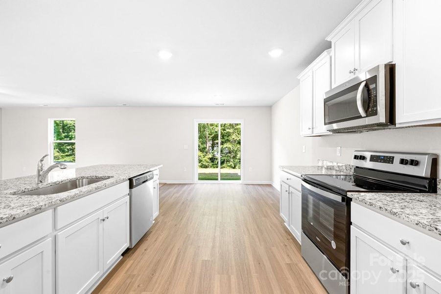 Furnished interior view inside a new home in McKee Creek Village, Charlotte (Image 5). Furnished interior view inside a new home in McKee Creek Village, Charlotte (Image 5).
