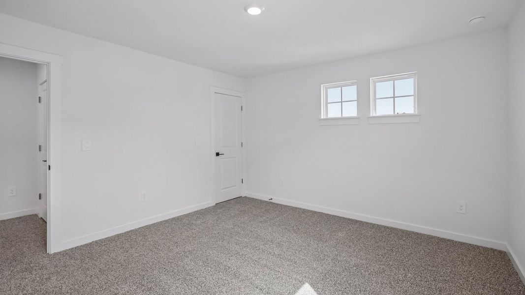 Spacious, unfurnished interior of a new home in Rosenbusch Ranch, Leander (Image 52).